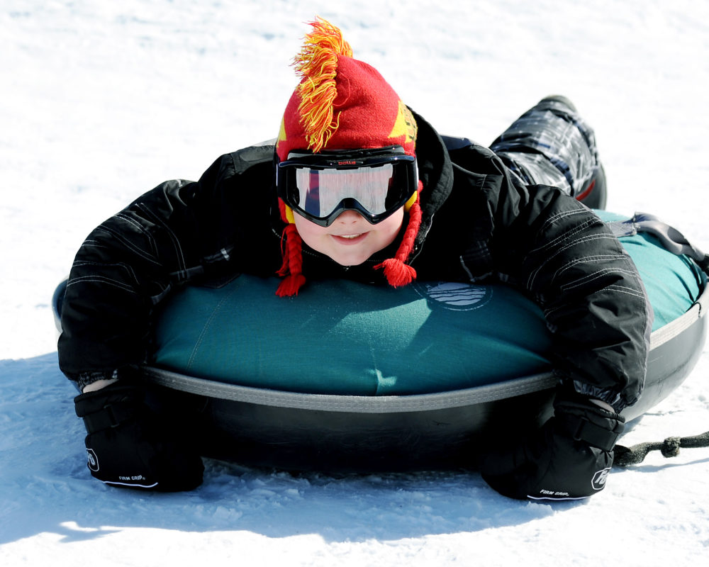 child at tubing hill