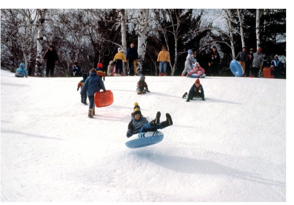 kids sledding at tubing hill