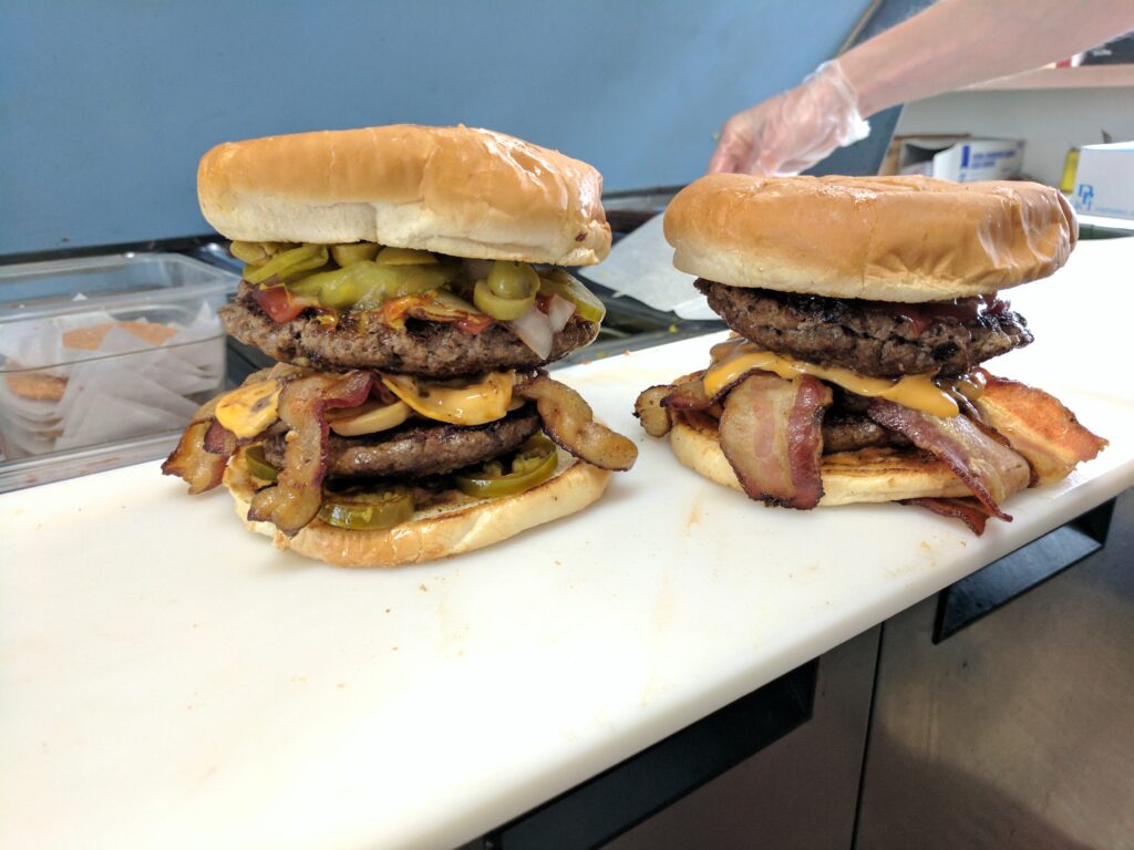 two double burgers with bacon